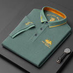 Green polo shirt with gold accents on a dark surface