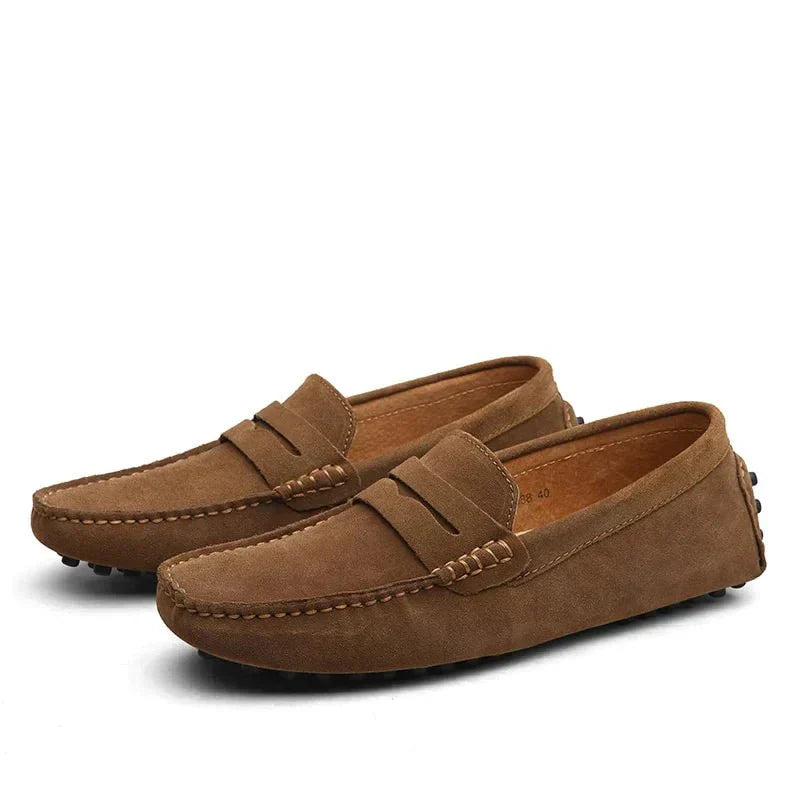 Pair of brown loafers on a white background
