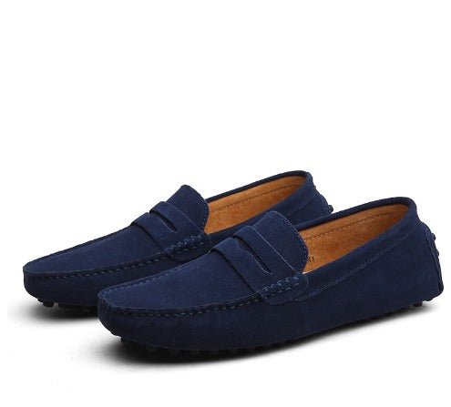 Pair of blue loafers on a white background