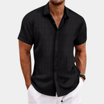Man wearing a black pinstripe short-sleeve shirt on a white background