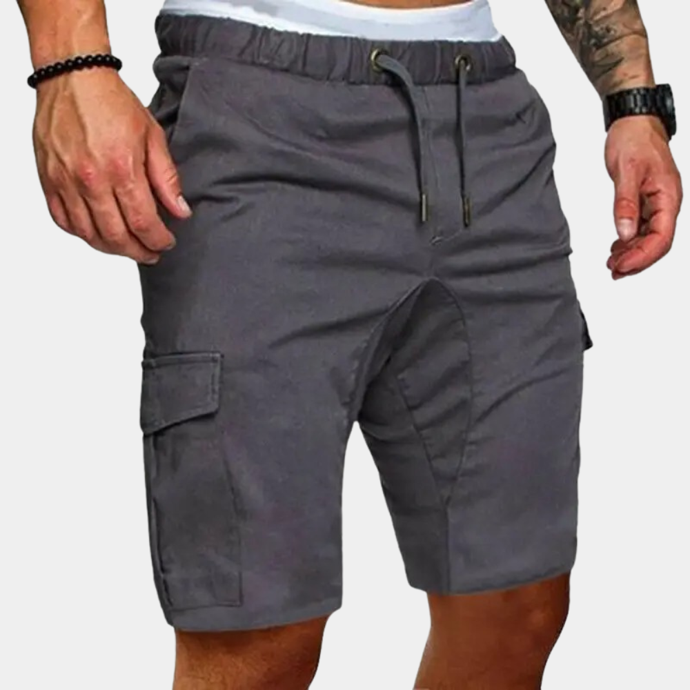 Gray cargo shorts worn by a person on a plain background