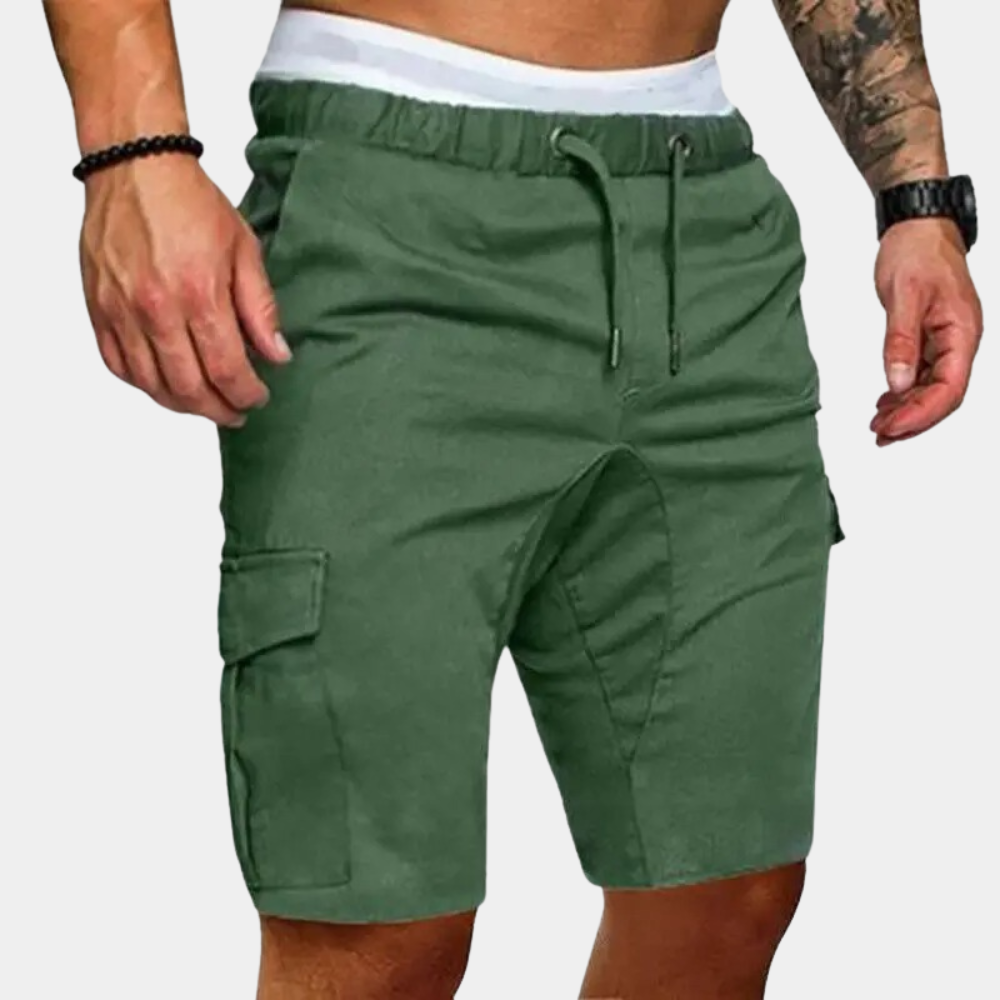 Green cargo shorts worn by a person on a white background
