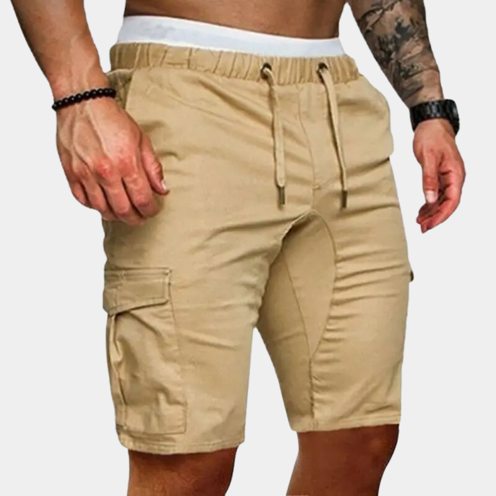 Beige cargo shorts worn by a person on a white background