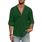 Man wearing a green shirt and gray pants on a white background
