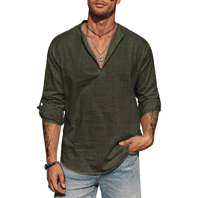 Man wearing a green shirt and blue jeans on a white background