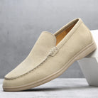 Beige loafer shoe on a light gray background