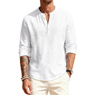 Man wearing a white long-sleeve shirt with rolled-up sleeves on a white background