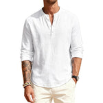 Man wearing a white long-sleeve shirt with rolled-up sleeves on a white background