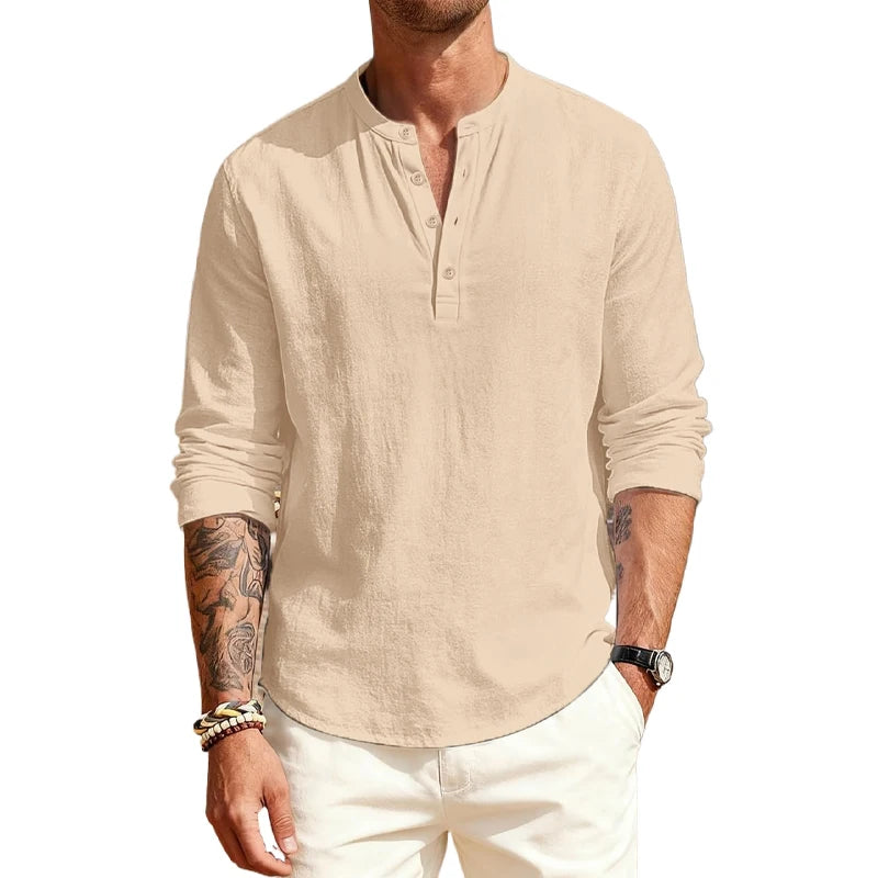 Man wearing a beige long-sleeve shirt with a logo on a white background