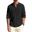 Man wearing a black long-sleeve shirt with a brand logo on a white background