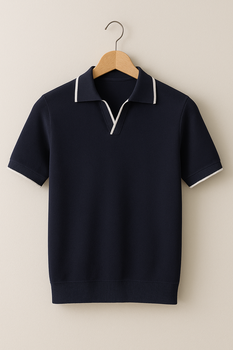 Navy short-sleeve sweater with white trim on a wooden hanger against a beige background