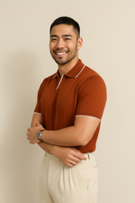 Man wearing a brown polo shirt with white trim on a beige background
