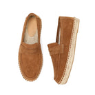 Pair of brown suede loafers with jute sole on a white background