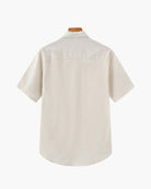 Beige short-sleeve shirt on a white background