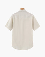Beige short-sleeve shirt on a white background