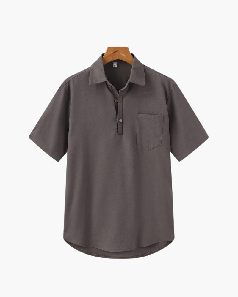 Gray short-sleeve shirt on a hanger with a white background