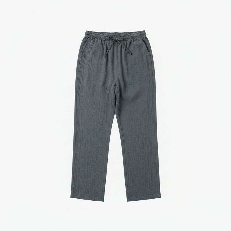 Gray pants on a hanger against a white background