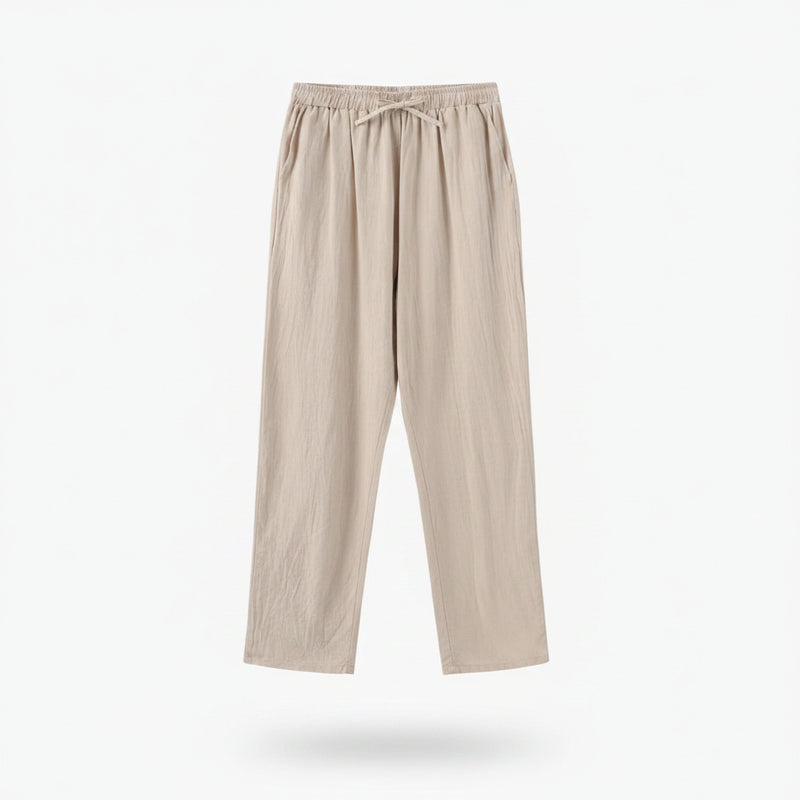Beige pants on a hanger against a white background