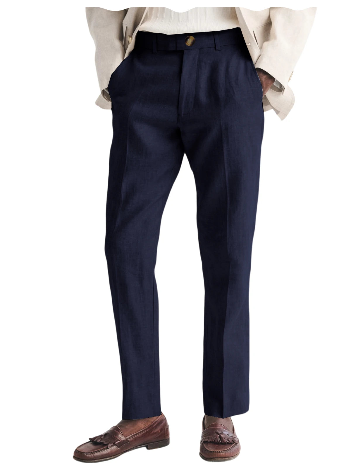 Navy blue dress pants worn with a beige jacket and brown shoes on a white background