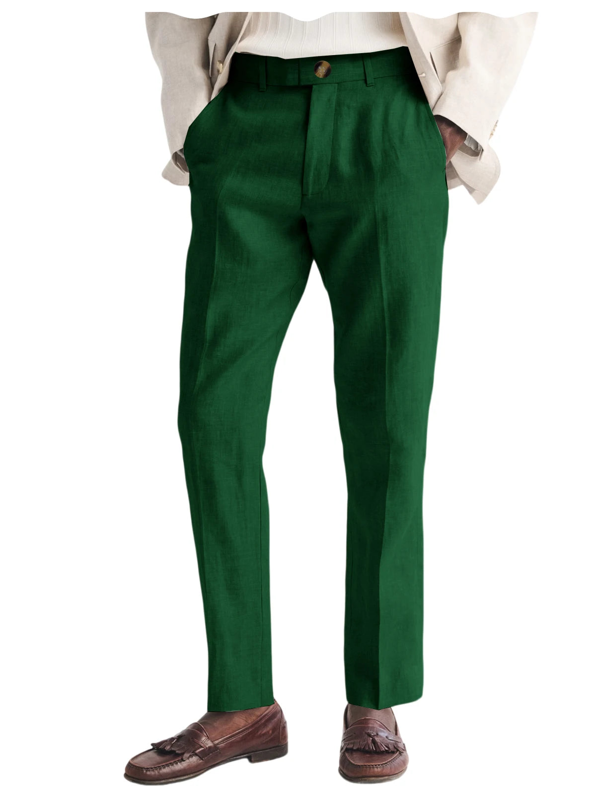 Green dress pants worn with a beige jacket and brown shoes on a white background