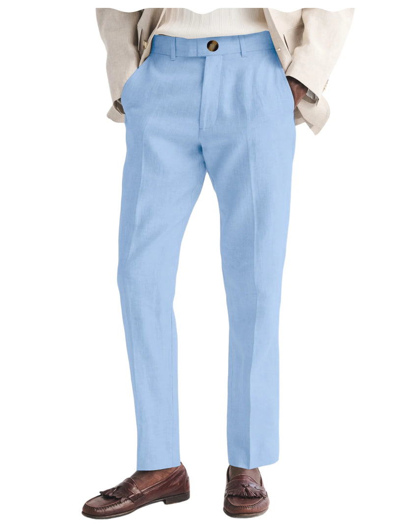 Light blue dress pants worn with a beige jacket and brown shoes on a white background