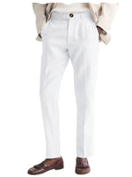 Light gray dress pants worn with a beige jacket and brown loafers on a white background