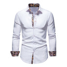 White dress shirt with patterned cuffs and collar on a white background