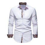 White dress shirt with patterned cuffs and collar on a white background