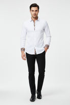 White dress shirt with patterned cuffs and collar on a white background
