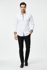 White dress shirt with patterned cuffs and collar on a white background