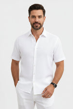 Man wearing a white short-sleeve shirt on a light gray background