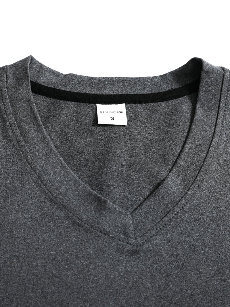 Close-up of a gray shirt with a brand label on a white background