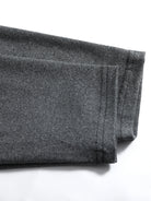 Folded dark gray fabric on a white background