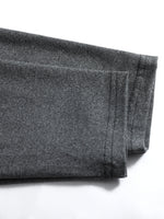 Folded dark gray fabric on a white background