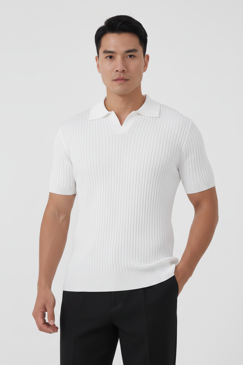 Man wearing a white ribbed polo shirt and black pants on a white background