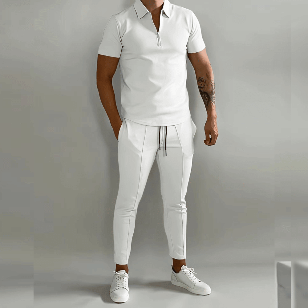 Person wearing a white outfit with a plain background