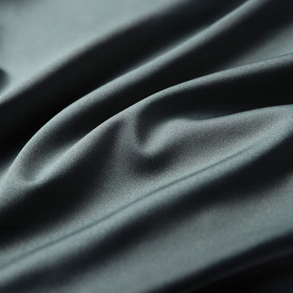 Close-up of dark gray fabric with folds