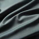 Close-up of dark gray fabric with folds