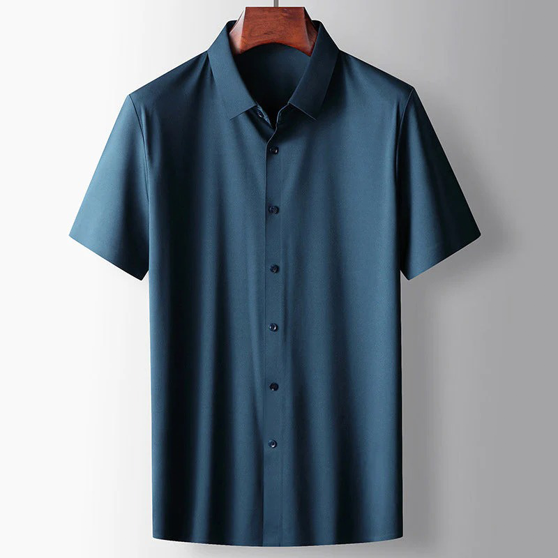 Blue short-sleeve shirt on a wooden hanger against a gray background