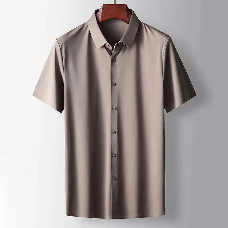 Beige short-sleeve shirt on a hanger against a light gray background