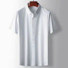 White short-sleeve shirt on a wooden hanger against a gray background
