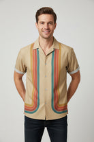 Beige shirt with colorful stripe pattern on a white background