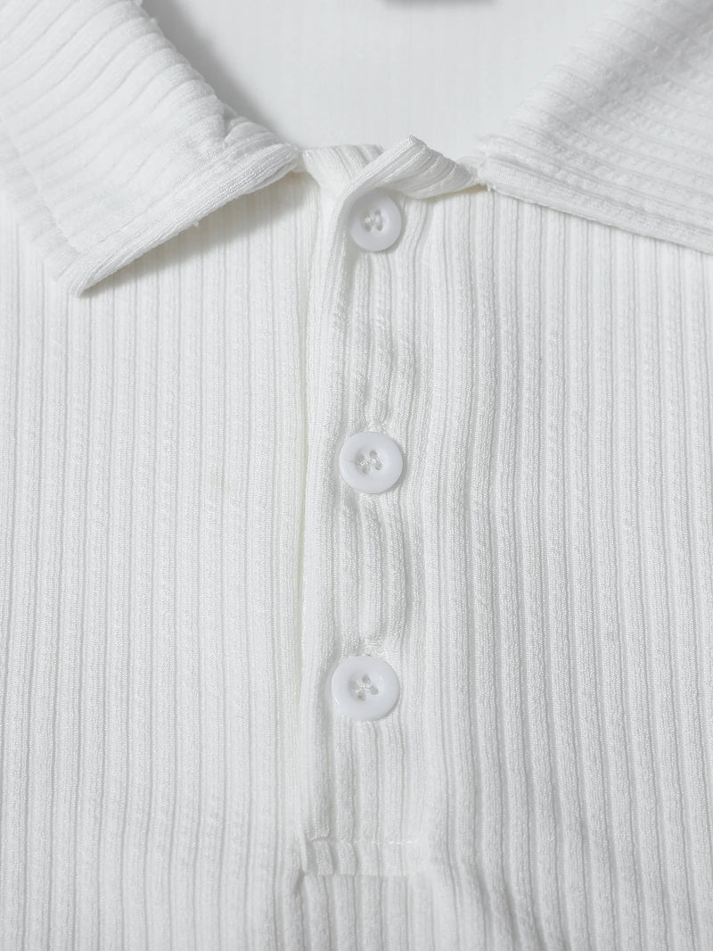 Close-up of a white ribbed shirt with buttons