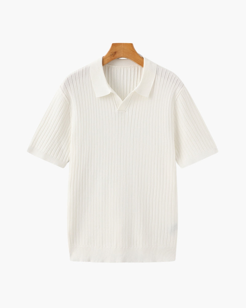 White ribbed polo shirt on a wooden hanger against a white background