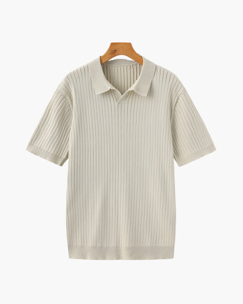 Beige ribbed knit polo shirt on a hanger against a white background