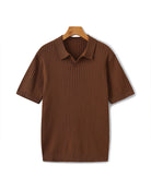 Brown ribbed polo shirt on a hanger against a white background