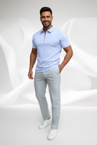 Light blue polo shirt with a zipper on a white background