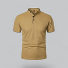 Beige short-sleeve henley shirt on a gray background