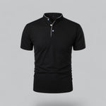 Black polo shirt with white buttons on a gray background
