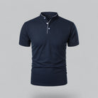 Navy blue polo shirt on a gray background
